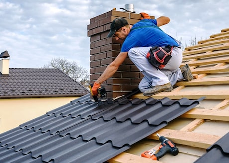Roofing contractor working on a roof